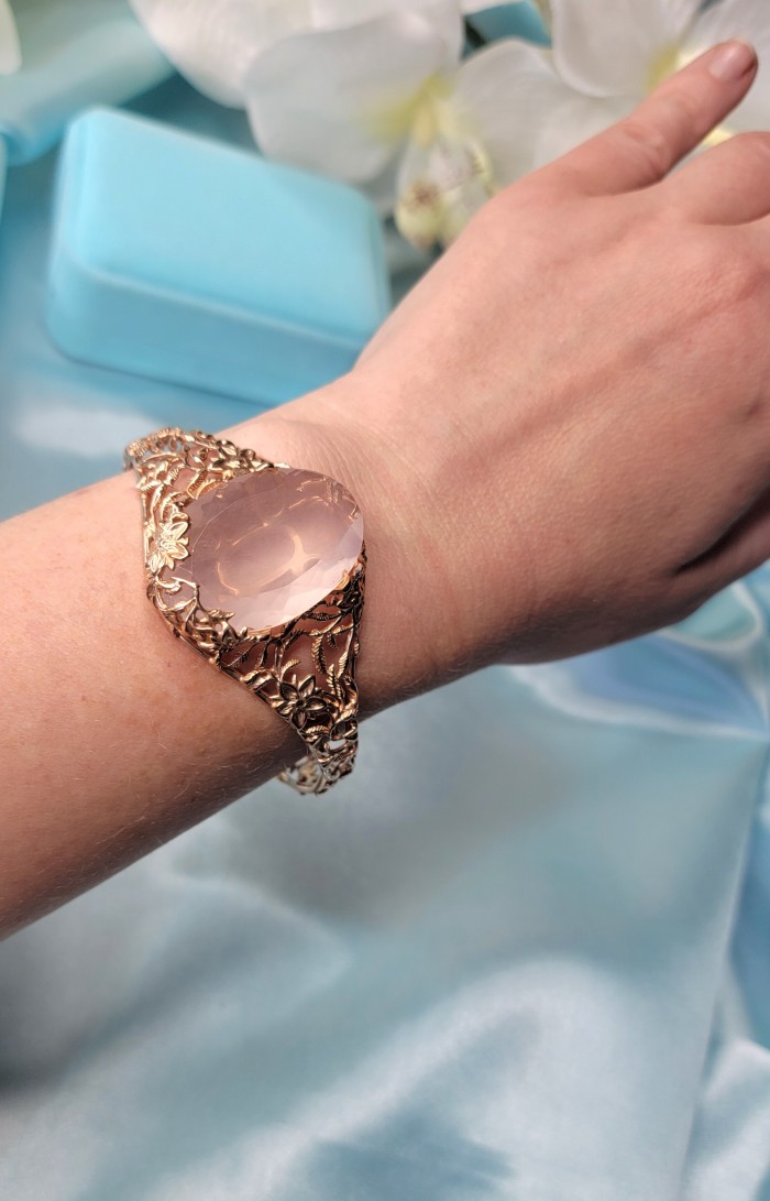 Incredible Genuine 52.2 carat Brazilian Rose Quartz Rose Quartz .925 Sterling Silver handcrafted Bracelet / Cuff - Rose Quartz bracelet worn on wrist, intricate gold floral design.