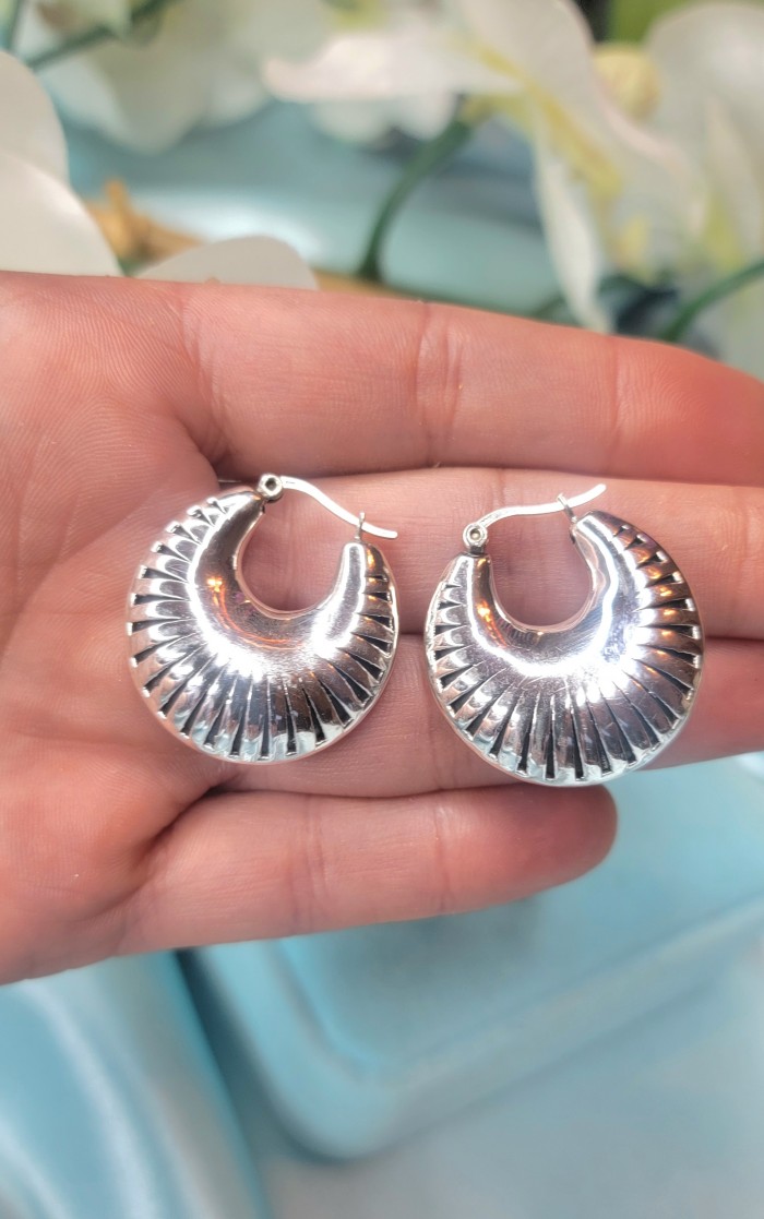Highly Polished Fancy Modern design .925 Sterling Silver Italy made Earrings - Close-up of polished sterling silver earrings held in hand.