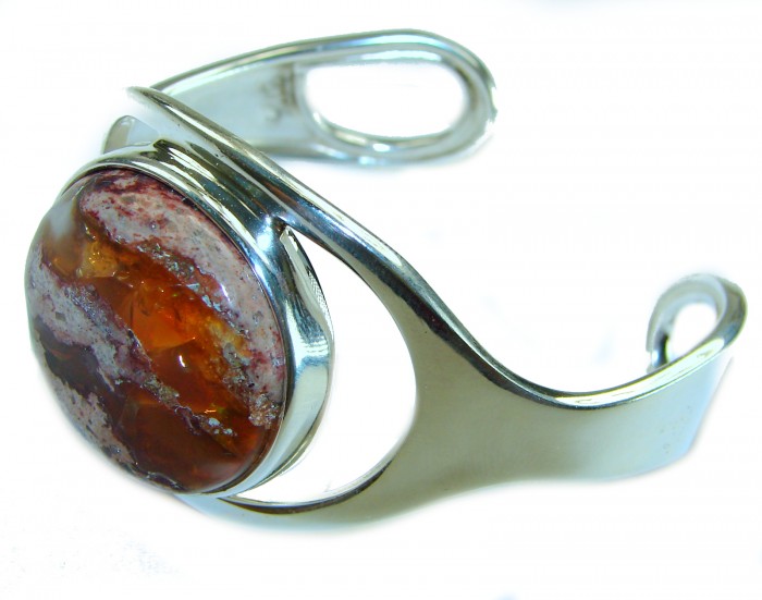 Simplicity 85.5 carat Genuine Mexican Fire Opal handcrafted .925 Sterling Silver Bracelet / Cuff - Side view of bracelet with 85.5 carat Mexican Fire Opal stone
