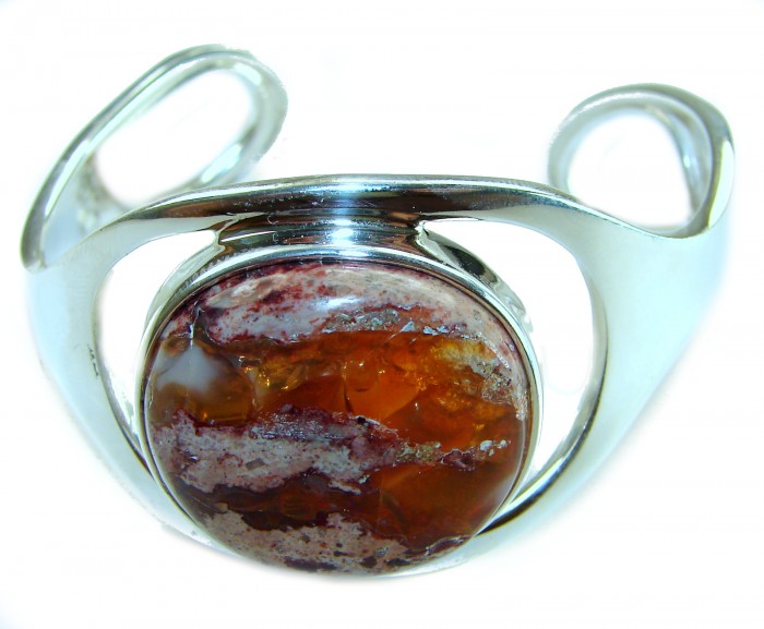 Simplicity 85.5 carat Genuine Mexican Fire Opal handcrafted .925 Sterling Silver Bracelet / Cuff - Close-up of a silver bracelet with a Mexican Fire Opal centerpiece.