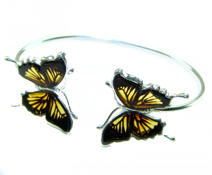 Golden Butterfly Genuine carved Baltic Amber .925 Sterling Silver handamde Bracelet - Side view of butterfly-shaped Baltic amber sterling silver bracelet.