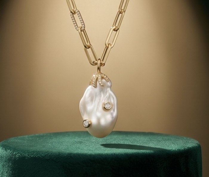 Precious Mother of Pearl 18K Gold over .925 Sterling Silver .925 Sterling Silver Necklace; 16 inches long - Front view of pearl pendant necklace on a green stand.