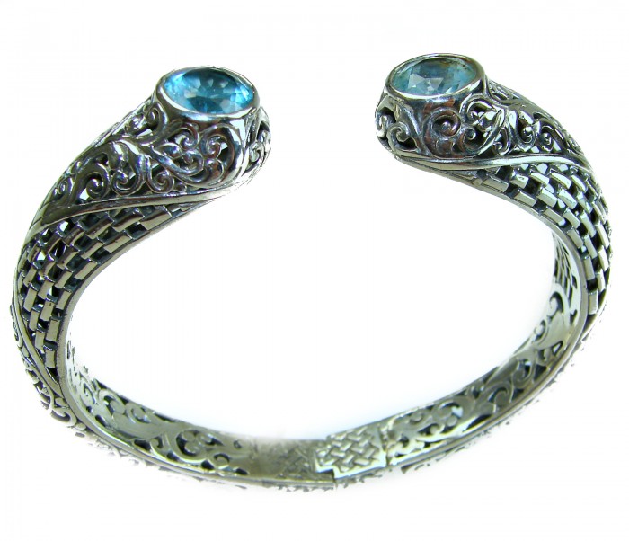 Large and Heavy Bali Legacy 45.5 grams authentic 10.9 carat Swiss Blue topaz Floral Bracelet in .925 Sterling Silver handcrafted - Bali Legacy bracelet with blue stones, intricate design, top view detail.