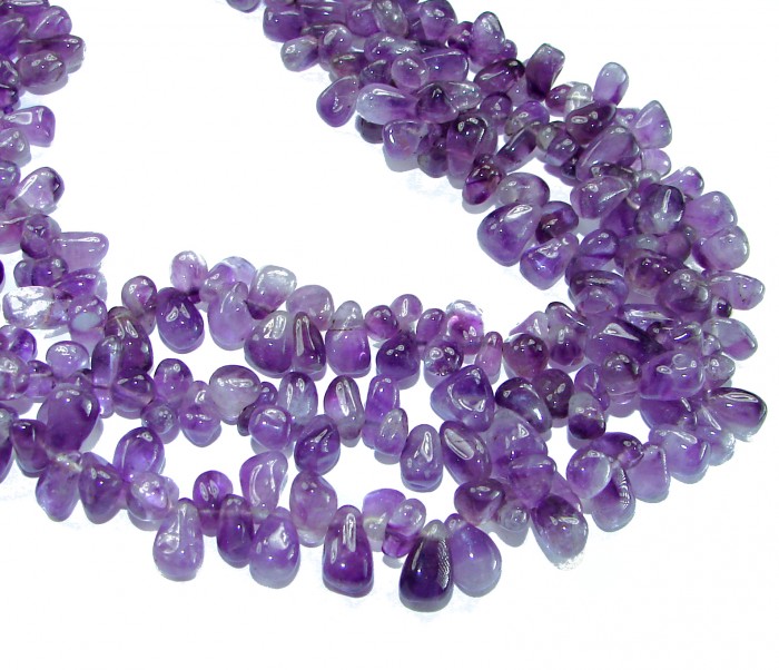 Oriental Beauty 178.2 carat Amethyst .925 Sterling Silver handcrafted Necklace - Close-up of polished amethyst stones in a necklace arrangement.