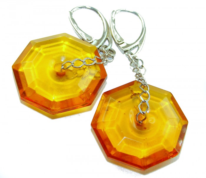Very Special product - Wonderful natural faceted Baltic Amber .925 Sterling Silver entirely handcrafted earrings - Close-up of faceted amber earrings with silver clasps.