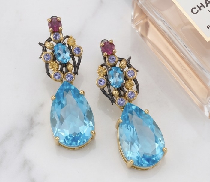 Atlantica 18.7 carat Swiss Blue Topaz BLACK RHODIUM OVER and 18k Gold .925 Sterling Silver Handcrafted Statement earrings - Close-up of Atlantica earrings with Swiss blue topaz and gemstones.