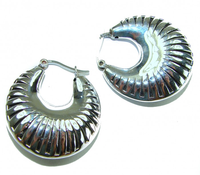 Highly Polished Fancy Modern design .925 Sterling Silver Italy made Earrings - Fancy .925 Sterling Silver earrings, textured design, top angle view.