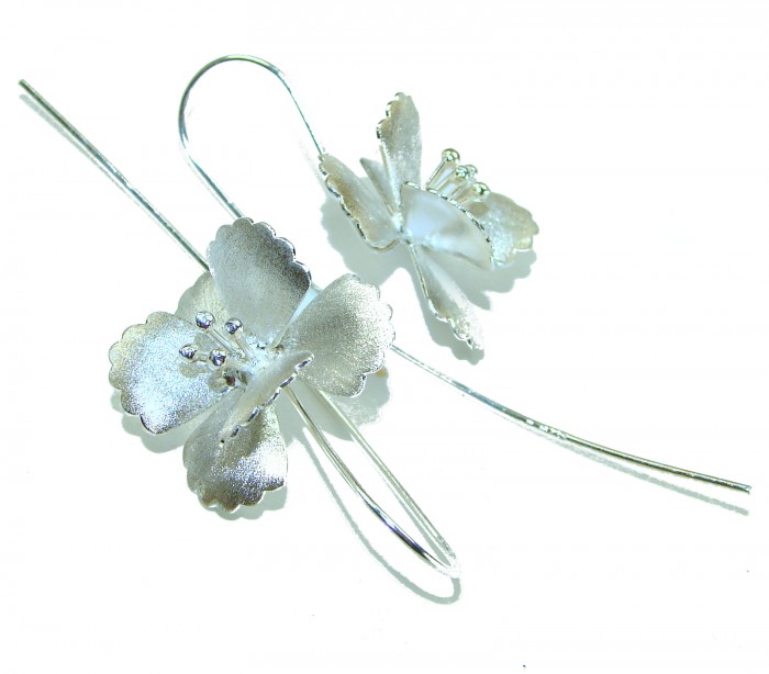 Silver Flowers Italy made .925 Sterling Silver Earrings - Close-up of Italy made .925 sterling silver flower earrings, top view.