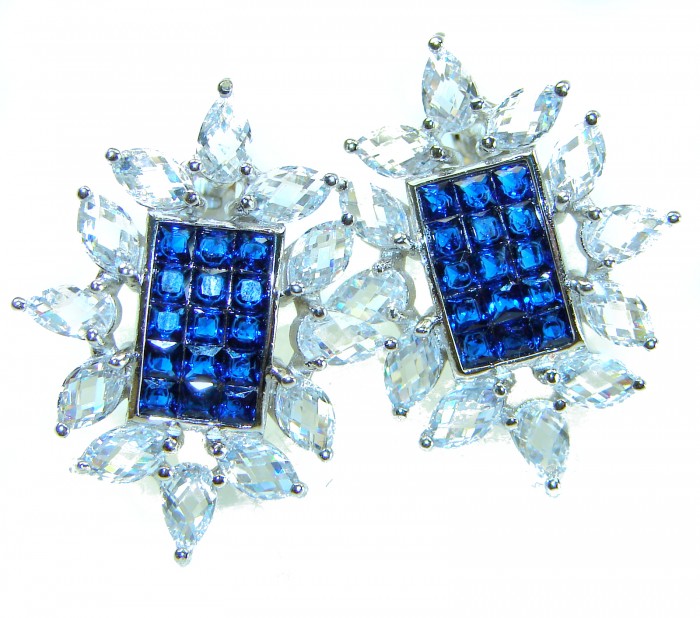 Born to Glam authentic 10.5 carat Sapphire .925 Sterling Silver handcrafted earrings - Front view of sapphire and clear stone earrings on white background.