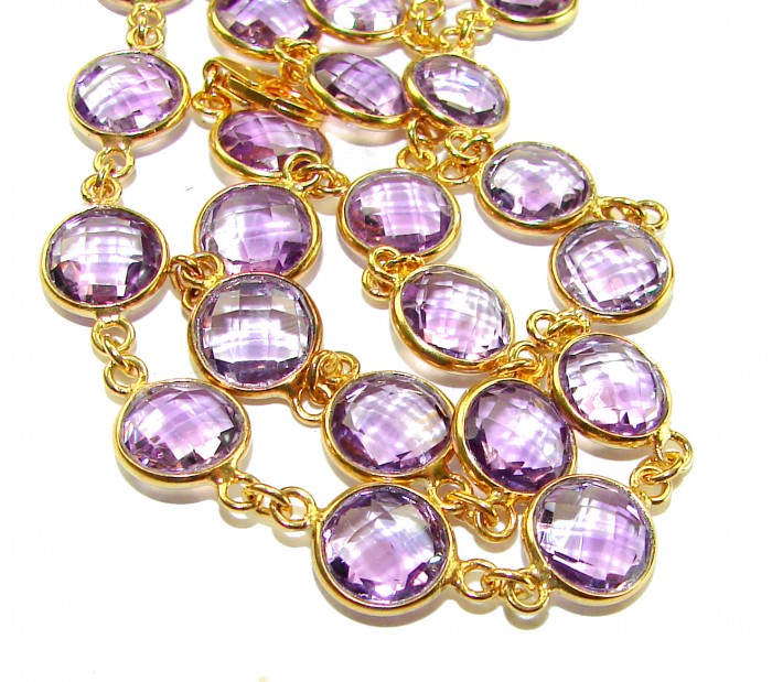 A Heritage in Bloom - Italy made 28.5 carat Amethyst .925 Sterling Silver dipped in 18K Gold handmade necklace - Close-up of linked amethyst stones in gold setting, no clasp visible.