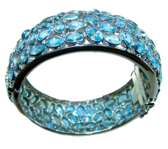 Blue Odyssey- One of the kind - 165.2 carat Swiss Blue Topaz .925 Sterling Silver handmade bangle Bracelet - Side view of Blue Odyssey bracelet with Swiss Blue Topaz stones.