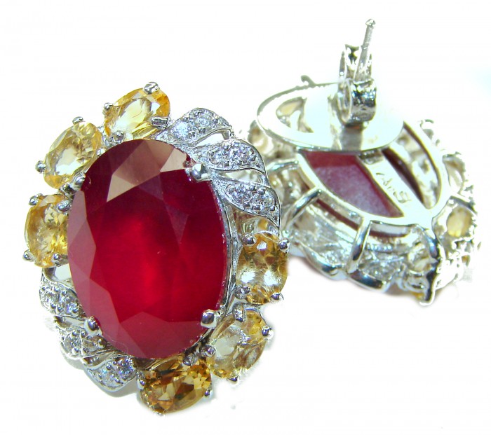 Black Lable Collection - Blooming Roses Authentic 28.9 carat Mozambique Ruby Rhodium over .925 Sterling Silver brilliantly handcrafted earrings - Front view of ornate earrings with large red stone and diamond accents.