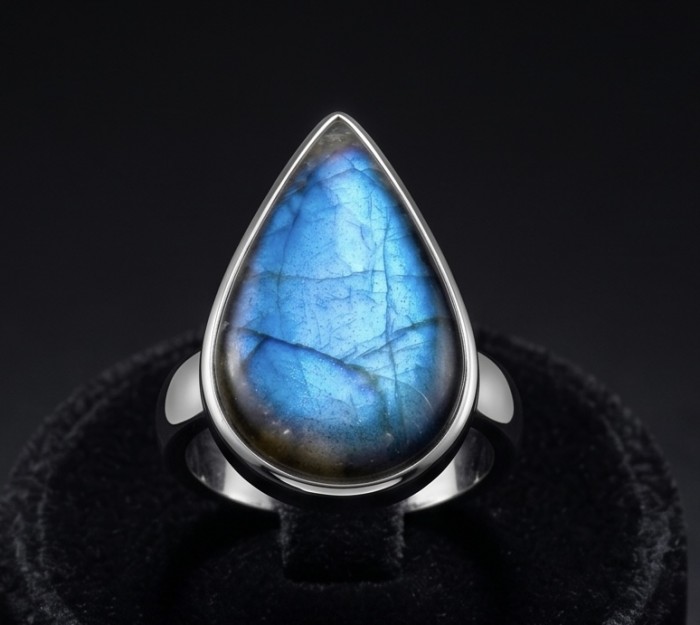 Shimmering Natural Labradorite .925 Sterling Silver handcrafted Large ring size 8 adjustable - Labradorite ring in teardrop shape, front view on black background.