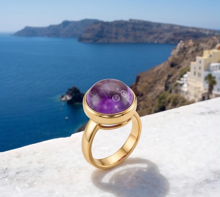 Purple Royalty 20.5 carat Amethyst .925 Sterling Silver dipped in 18K Gold Handcrafted Ring size 8 adjustable - Amethyst ring on marble ledge with ocean view in background.