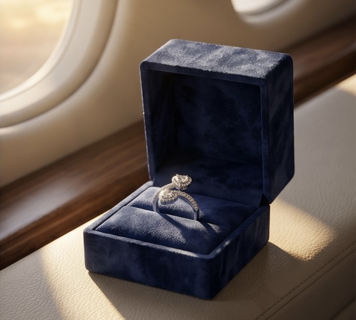 Endless Love Luxurious 4.5 carat White Topaz .925 Sterling Silver Solid Infinity ring size 7 3/4 - Ring in blue box on airplane seat, window light highlighting the design