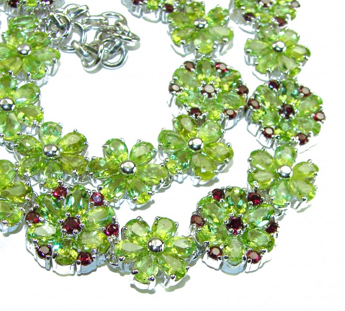 Mint Whisper - Great Masterpiece 252.2 carat genuine Peridot .925 Sterling Silver handmade Statement necklace - Close-up of floral Peridot necklace with silver settings and red accents.