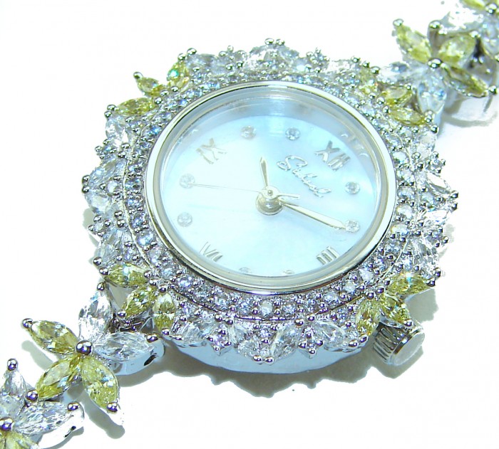 Precious 108.8 carat natural Peridot White Topaz .925 Sterling Silver handmade Bracelet - Watch - Close-up of luxury watch with gemstones and mother-of-pearl face