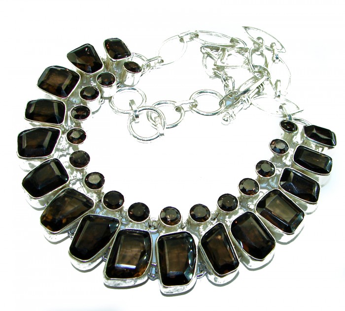 Precious genuine 88.9 carat Smoky Topaz .925 Sterling Silver handcrafted Necklace - Necklace with smoky topaz stones, top view, chain detail visible.