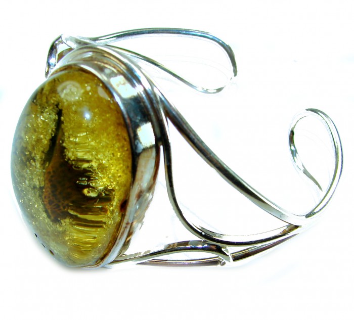 Golden Odyssey Huge Genuine Baltic Amber .925 Sterling Silver handcrafted Bracelet / Cuff - Side view of Golden Odyssey Baltic Amber bracelet in sterling silver.