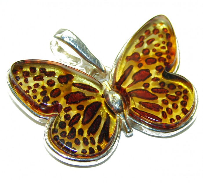 Prehistoric Authentic Butterscotch Baltic Amber .925 Sterling Silver beautifully handcrafted Pendant - Butterfly pendant close-up, amber in sterling silver.