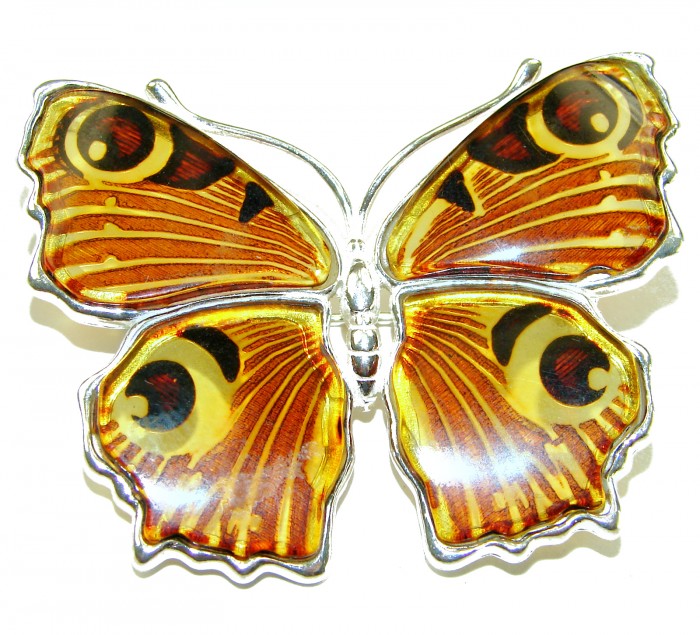 Large Golden Butterfly carved Baltic Polish Amber .925 Sterling Silver handcrafted Pendant / Brooch - Golden butterfly amber brooch, top view, silver detail visible.