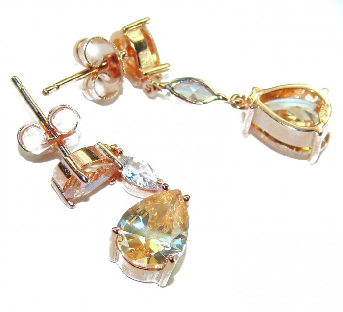 Luxurious Oval cut 7.5 carat Yellow Sapphire 18K Gold over .925 Sterling Silver handcrafted earrings - Close-up of luxurious yellow sapphire earrings in 18K gold setting.