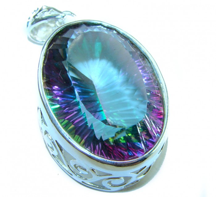 Blue Wonderland 49.7 carat oval cut Mystic Aurora Topaz .925 Sterling Silver handcrafted Pendant - Stone close-up of Blue Wonderland 49.7 carat oval Mystic Aurora Topaz.