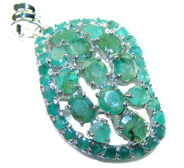Spectacular 18.8 carat authentic Colombian Emerald .925 Sterling Silver handcrafted Pendant - Close-up of Colombian emerald pendant with silver detailing.