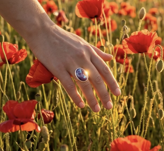 Purple Turquoise .925 Sterling Silver handcrafted ring; s. 7 - Ring worn on hand in poppy field, sunlight highlighting stone.