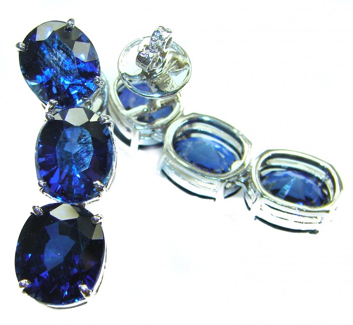 Oceania - Deep Ocean 22.5 carat London Blue Topaz .925 Sterling Silver handmade Statement earrings - Close-up of Oceania Deep Ocean blue topaz earrings with sterling silver.