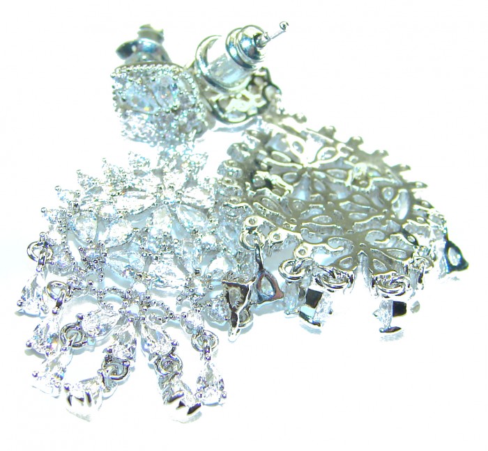 Precious genuine 11.9 carat White Topaz .925 Sterling Silver handcrafted earrings - Close-up of white topaz and sterling silver earring details.