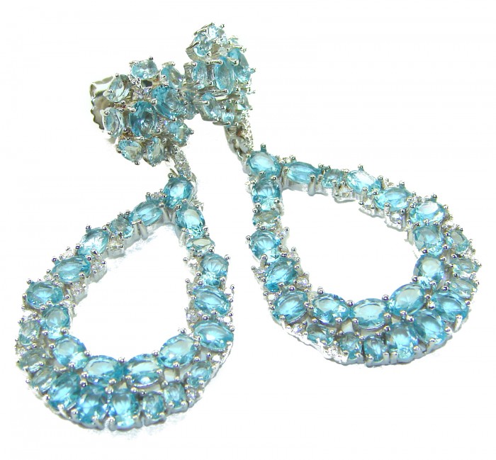 Serenity 18.5 carat genuine Swiss Blue Topaz .925 Sterling Silver handmade Large Statement earrings - Close-up of Swiss Blue Topaz teardrop earrings on white background.