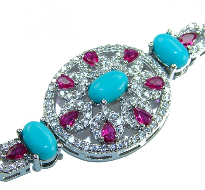Serenity- 21.5 carat genuine Swiss Blue Turquoise 9.5 carat Ruby .925 Sterling Silver handmade Statement Bracelet - Close-up of Serenity bracelet with turquoise and red gemstones.