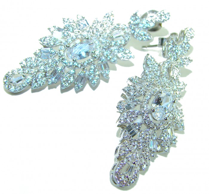 LUXURIUS 12.2 carat White Topaz .925 Sterling Silver handcrafted earrings - Close-up of white topaz earrings with intricate silver detailing.