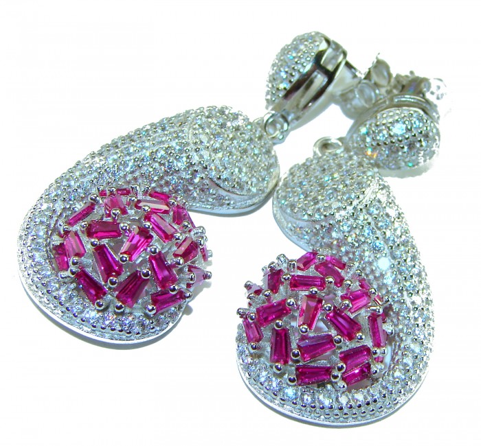 Pure Luxury 22.2 carat natural Ruby .925 Sterling Silver handmade Statement earrings - Close-up of ruby and sterling silver earrings with detailed design.