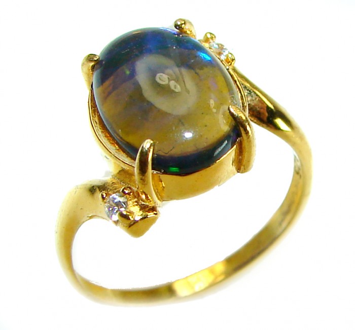 A COSMIC POWER Genuine 8.2 carat Black Opal 18K Gold over .925 Sterling Silver handmade Ring size 8 - Side view of a black opal ring with 18K gold setting.