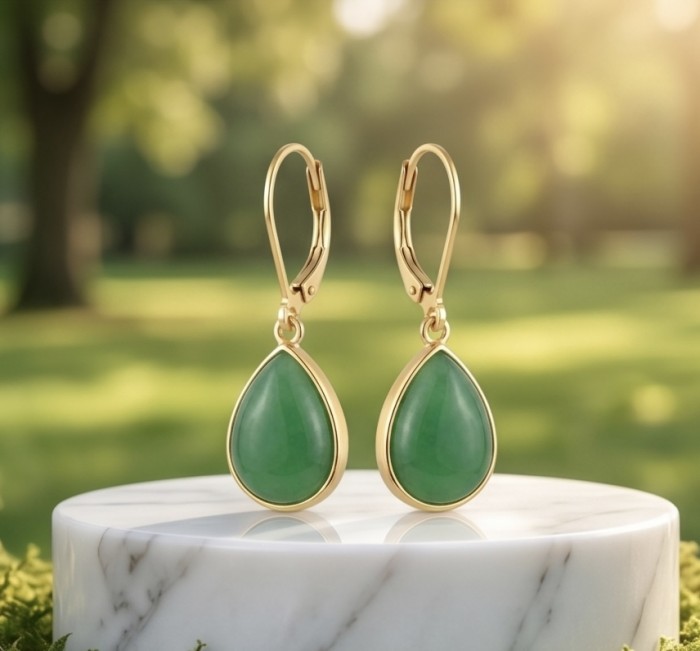 Unique genuine Jade 18K Gold over over .925 Sterling Silver handcrafted earrings - Teardrop jade earrings on marble stand, front view.