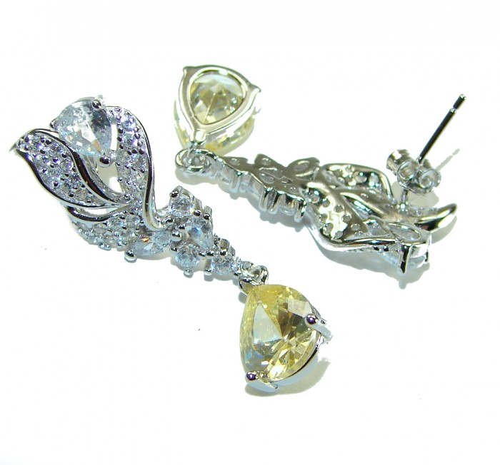 Authentic 4.5 carat Citrine .925 Sterling Silver brilliantly handcrafted earrings - Citrine and .925 sterling silver earrings with detailed stone close-up.