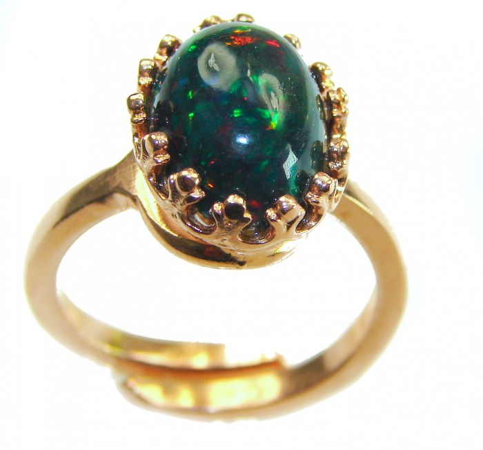 A COSMIC POWER Genuine 9.2 carat Black Opal 18K Gold over .925 Sterling Silver handmade Ring size 8 - Close-up of a black opal ring with gold setting and crown detail.