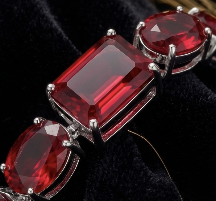 Bella Rosa - Magnificent 152.4 carat authentic Ruby .925 Sterling Silver handcrafted Bracelet - Ruby stone close-up on jewelry setting with silver prongs.