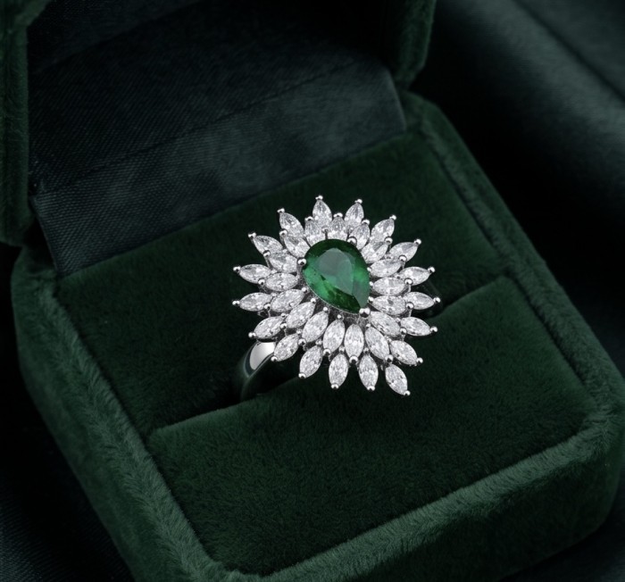 Luxurious 4.2 carat Colombian Emerald .925 Sterling Silver dipped in Rhodium handcrafted Ring size 8 1/4 - Emerald ring with diamonds in green box, top view.