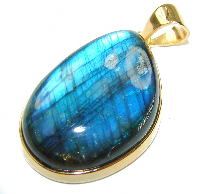 Magical Aurora 33.5 carat Fire Labradorite 14K Gold over .925 Sterling Silver handcrafted Pendant - Fire Labradorite pendant close-up, 14K gold setting, angled view.