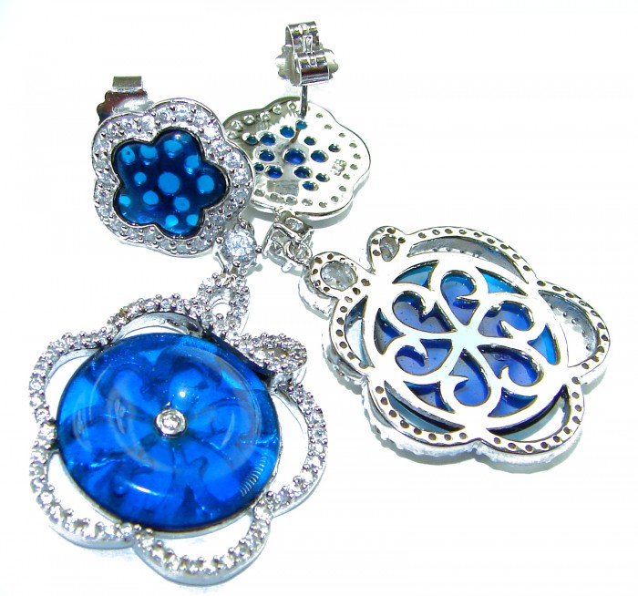 Giovanna - Authentic 21.9 carat Topaz .925 Sterling Silver handcrafted earrings - Close-up of blue topaz earrings with silver detailing.