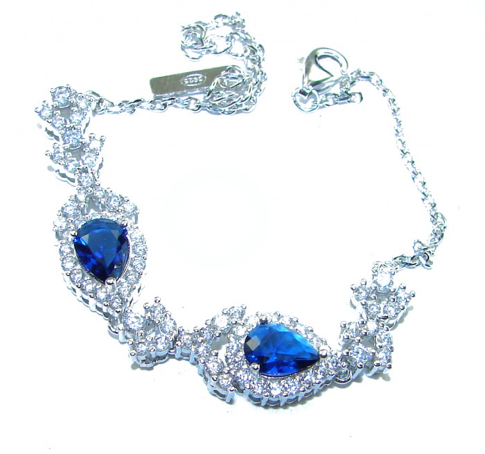 Magnificent Jewel 6.5 carat Sapphire .925 Sterling Silver handcrafted incredible Bracelet - Silver bracelet with sapphire stones and intricate detailing, overhead view.