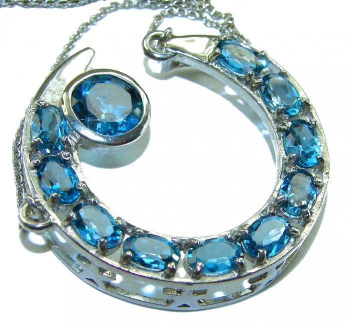 15.2 carat Blue Brilliance London Blue Topaz .925 Sterling Silver handcrafted Necklace - Close-up of crescent-shaped London Blue Topaz necklace on chain.