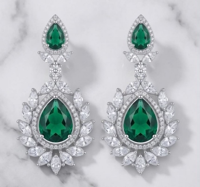 Magnificent Jewel 17.5 carat Emerald 14K white Gold over .925 Sterling Silver handcrafted earrings - Elegant earrings with emerald center stones and diamond accents, front view.