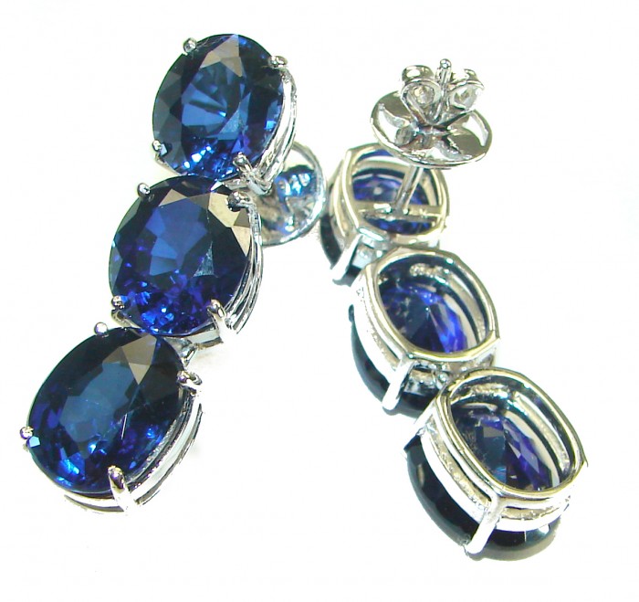 Deep Ocean 16.5 carat London Blue Topaz .925 Sterling Silver handmade Statement earrings - Earrings with blue topaz stones, close-up side view.