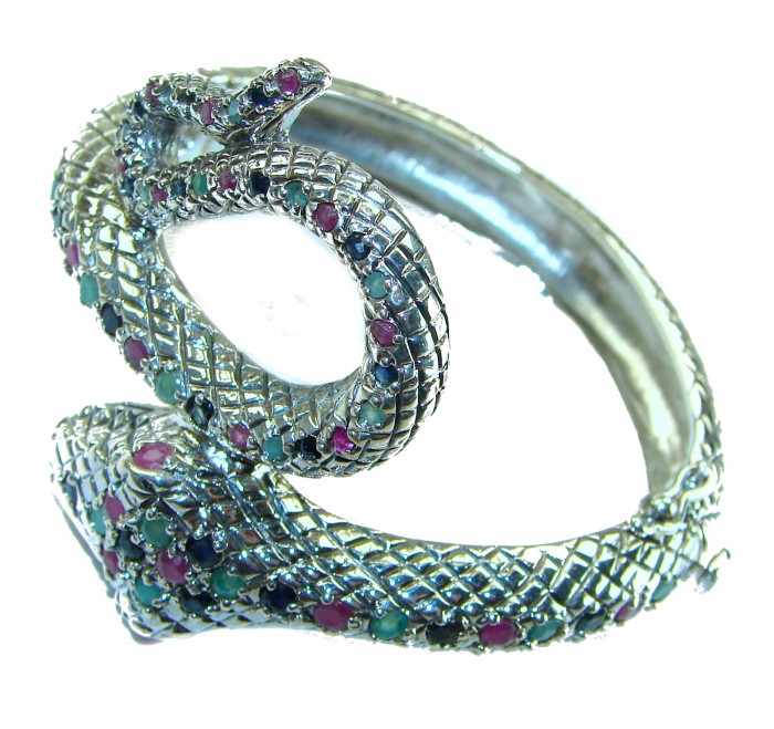 Huge 54.2 carat Precious Snake Genuine Ruby Emerald Sapphire .925 Sterling Silver handcrafted Bracelet - Snake-shaped bracelet with rubies, emeralds, and sapphires, side view.
