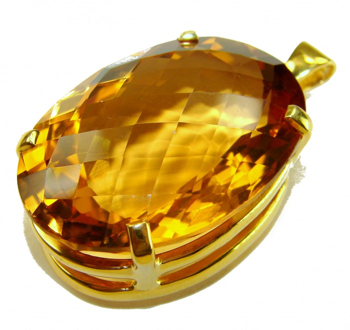 Luxury genuine 47.7CARAT oval cut Champagne Topaz .925 Sterling Silver dipped in 18K Gold handmade Pendant - Close-up of oval cut champagne topaz pendant with gold setting.