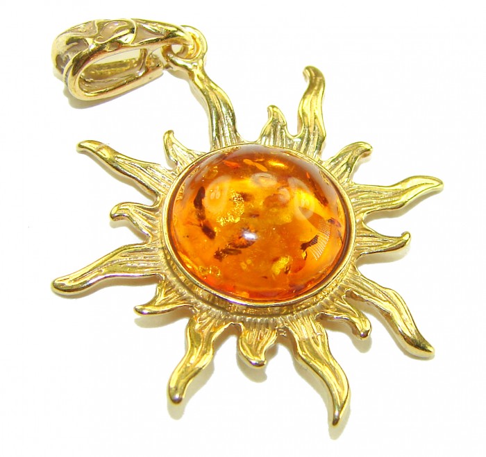 Bright Sun Baltic Polish Amber 22K Gold over .925 Sterling Silver handcrafted Pendant - Amber sun pendant in gold, top view, features detailed rays and clasp